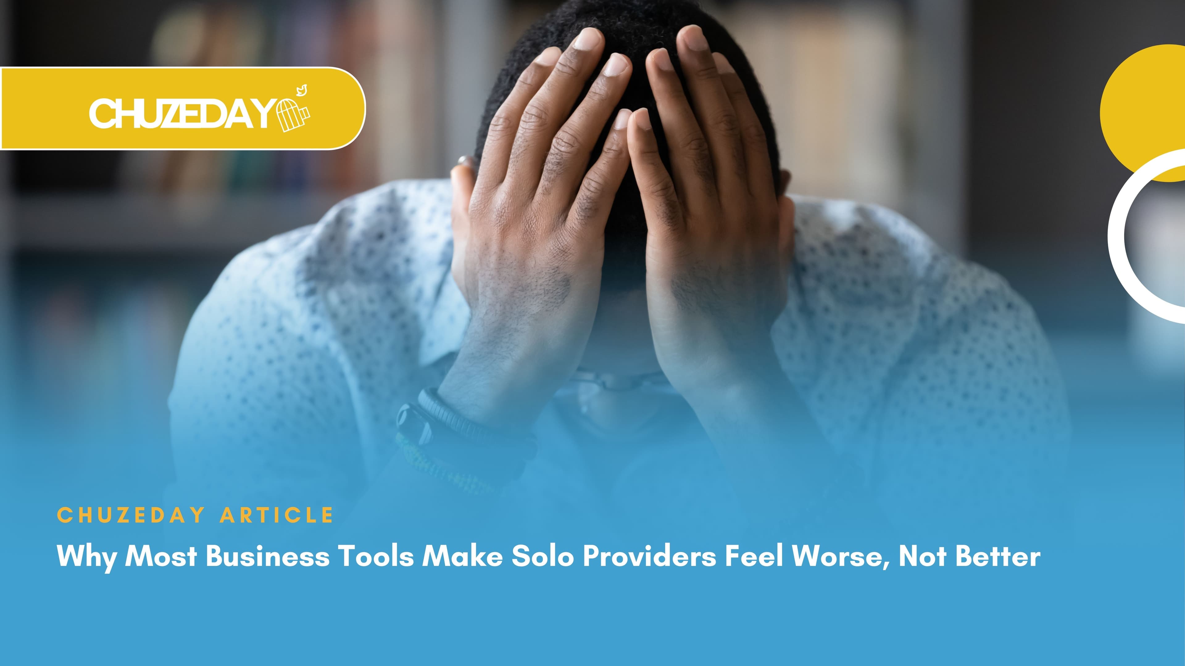 Business man at his work desk with his hands on his head, symbolising the difficulty of working for yourself and how using some software can have you riddled with frustration.